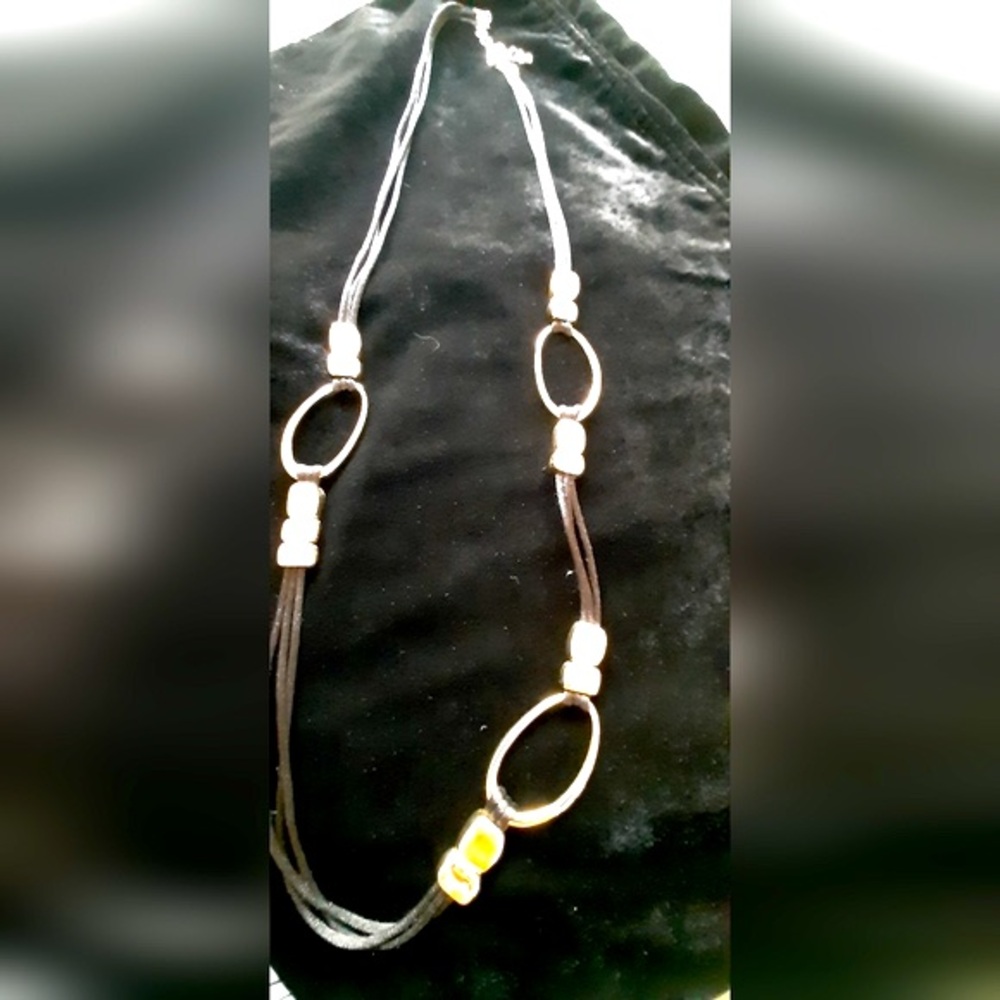 Chico’s long gold and black shoe lace necklace